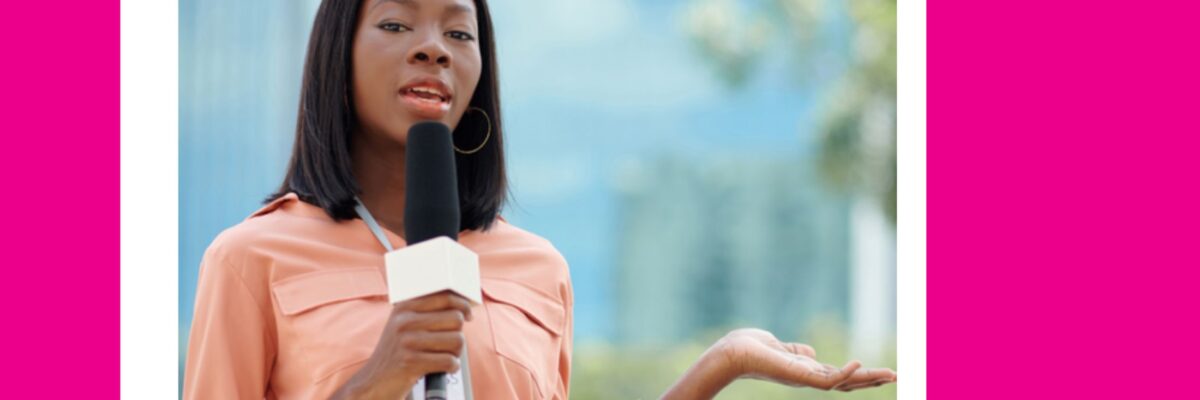 Woman journalist speaks into a microphone