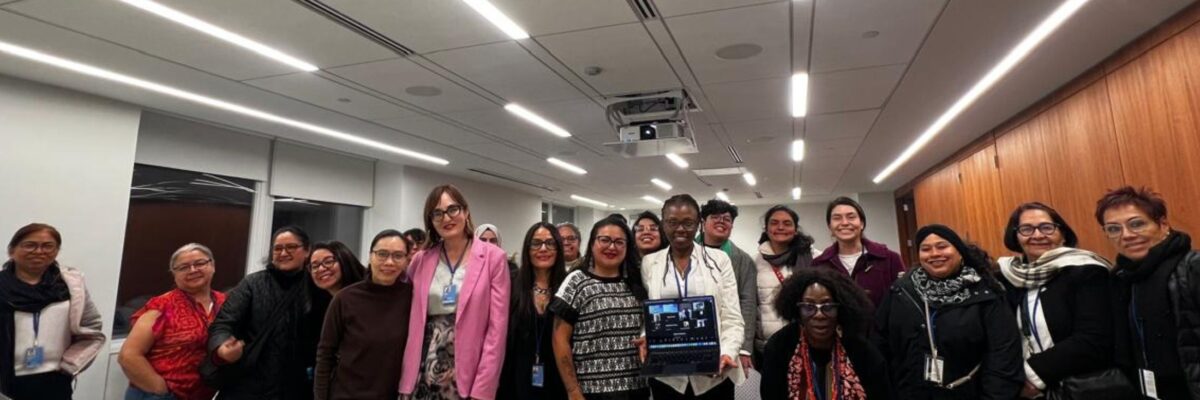 Participants of the WACC joint session stand in a group a the meeting room