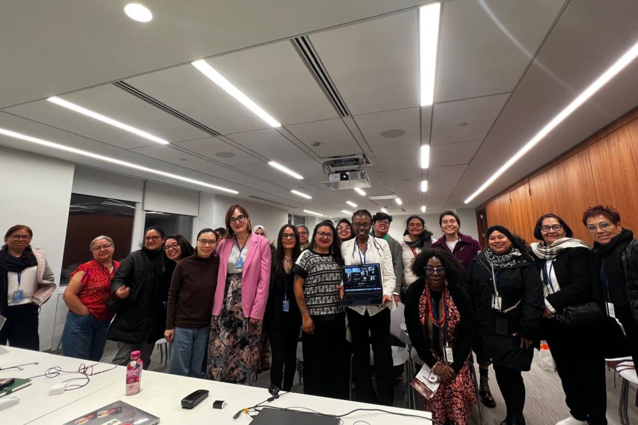 Participants of the WACC joint session stand in a group a the meeting room